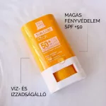 Sárga-fehér színű Solvre fényvédő stift vízcseppekkel borítva, körötte a termék főbb tulajdonságait jelző feliratokkal.