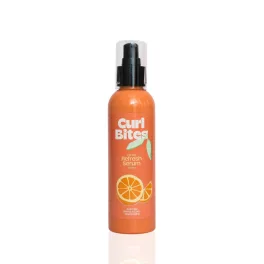 Curl Bites 2 Minute Refresh Serum narancssárga flakonban, pumpás adagolóval és narancs grafikával a címkén.